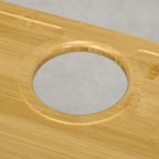 Bamboo-top cup holder opening in the table surface