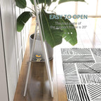 White full-length mirror tilted on an adjustable support stand for angled viewing