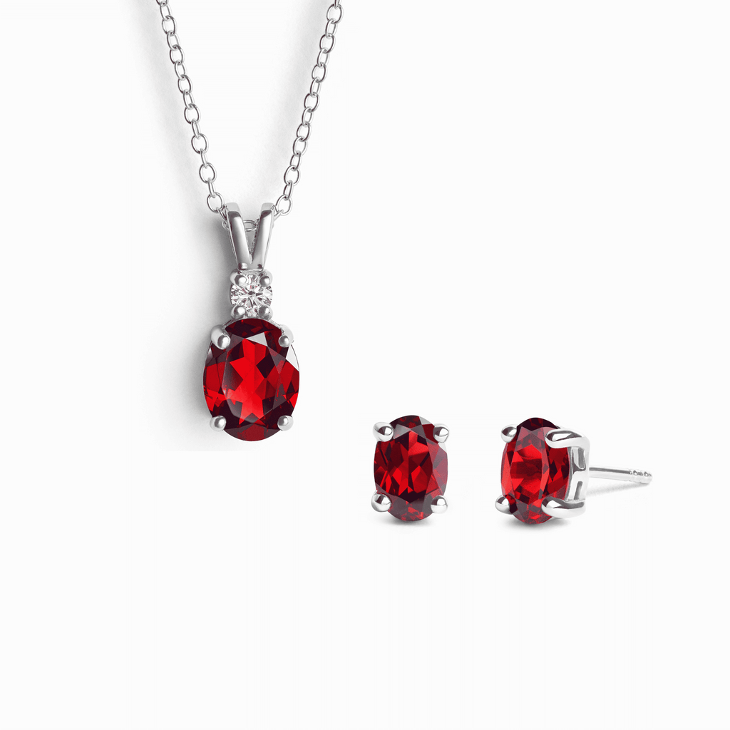 Sterling silver necklace with red oval garnet pendant and matching stud earrings