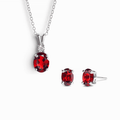 Sterling silver necklace with red oval garnet pendant and matching stud earrings