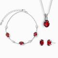 Sterling silver garnet jewelry set with red gemstone necklace, bracelet, and stud earrings