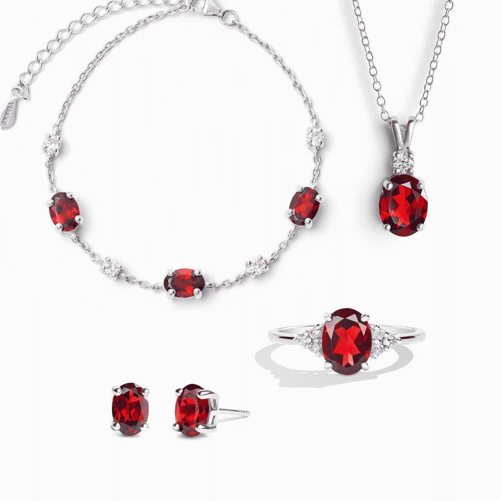 Sterling silver garnet jewelry set with red gemstones: necklace, bracelet, earrings, ring