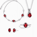 Sterling silver garnet jewelry set with red gemstones: necklace, bracelet, earrings, ring