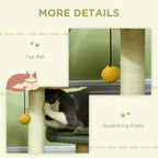 Cat tree detail view of scratching posts with dangling pom-pom toy ball and dark green bed