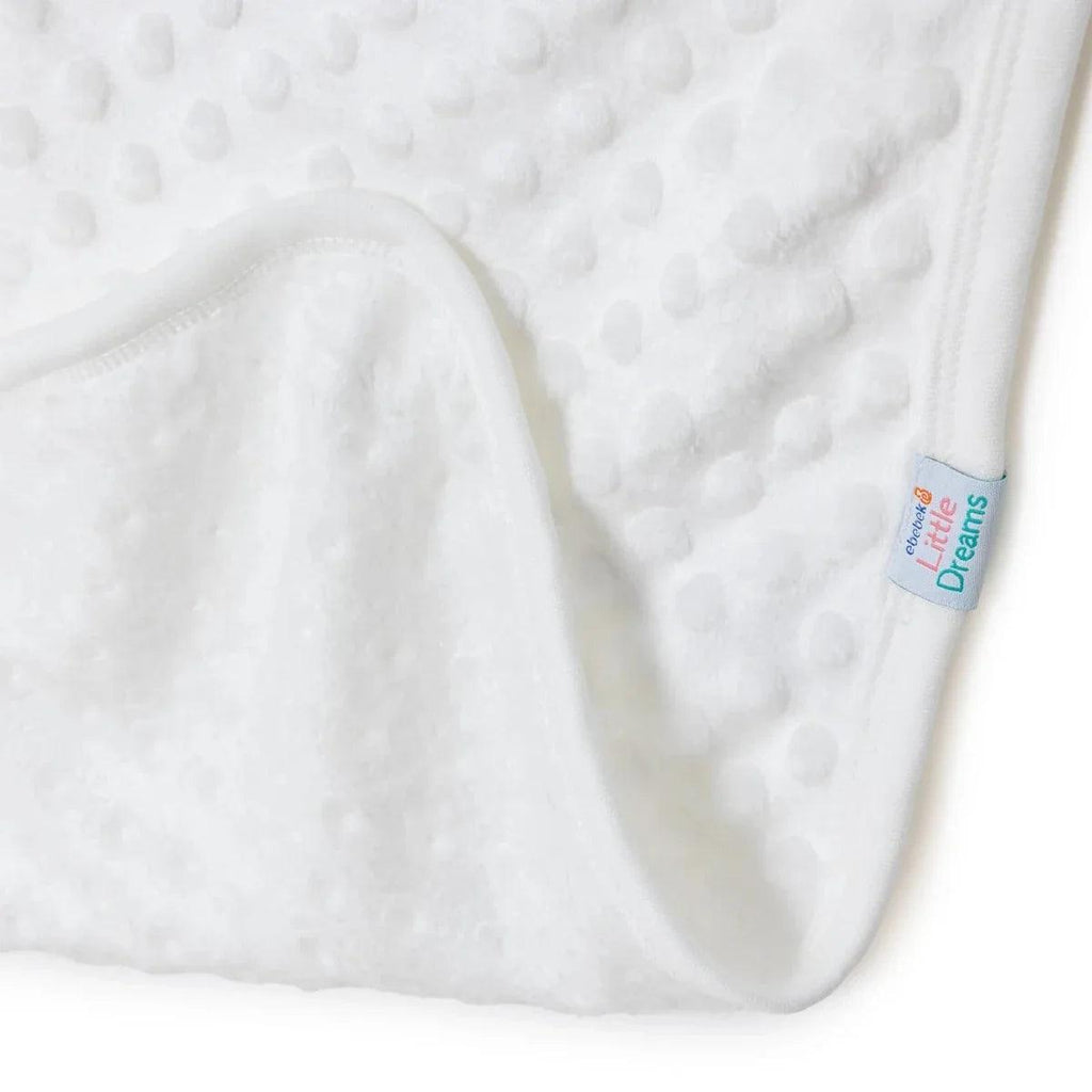 Ecru baby blanket corner close-up with rounded fold and textured dot fleece
