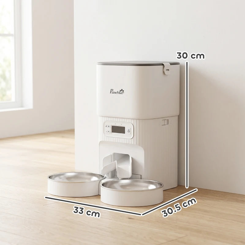 White automatic pet feeder with dual stainless steel bowls on wood floor, size labeled