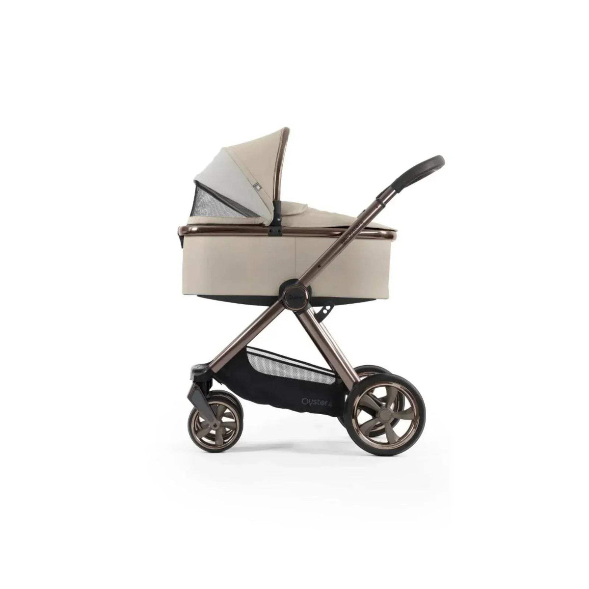 Buttermilk carrycot stroller with beige canopy and black frame, side three-quarter view