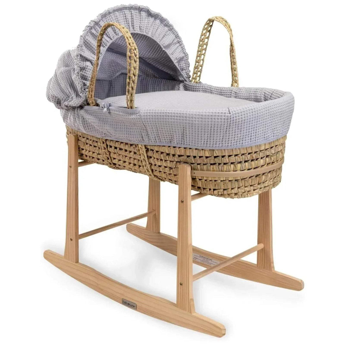 Wooden rocking stand with woven basket and gray draped cover on curved runners