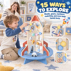 Rocket wooden activity cube with bead tracks, gears, and shape-sorting pieces, child reaching