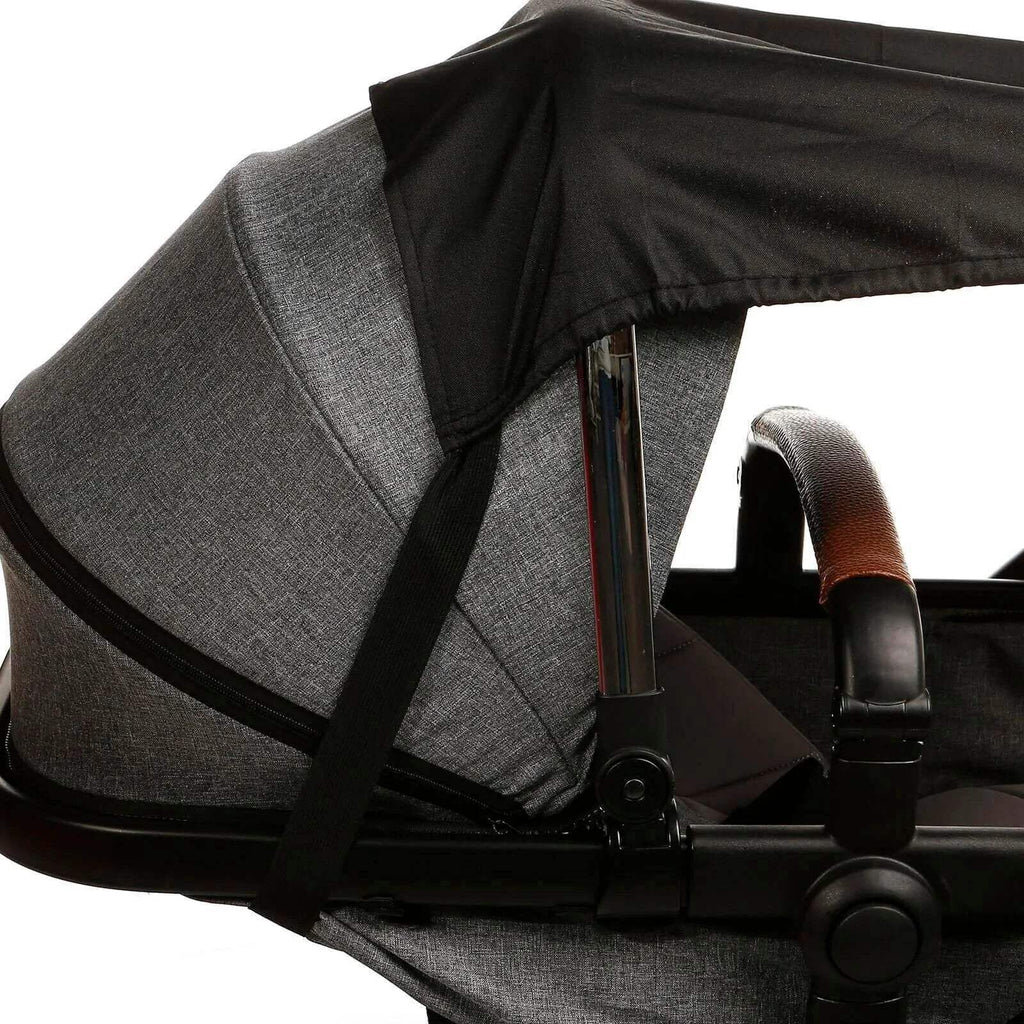 Stroller sunshade with black canopy attached over a gray stroller seat