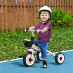 Pink kids tricycle with adjustable seat and front basket, with child rider