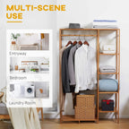 Bamboo clothes rack with hanging rod and open shelves, styled with folded bedding