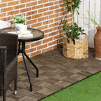 Charcoal grey wooden interlocking decking tiles with a herringbone slat layout