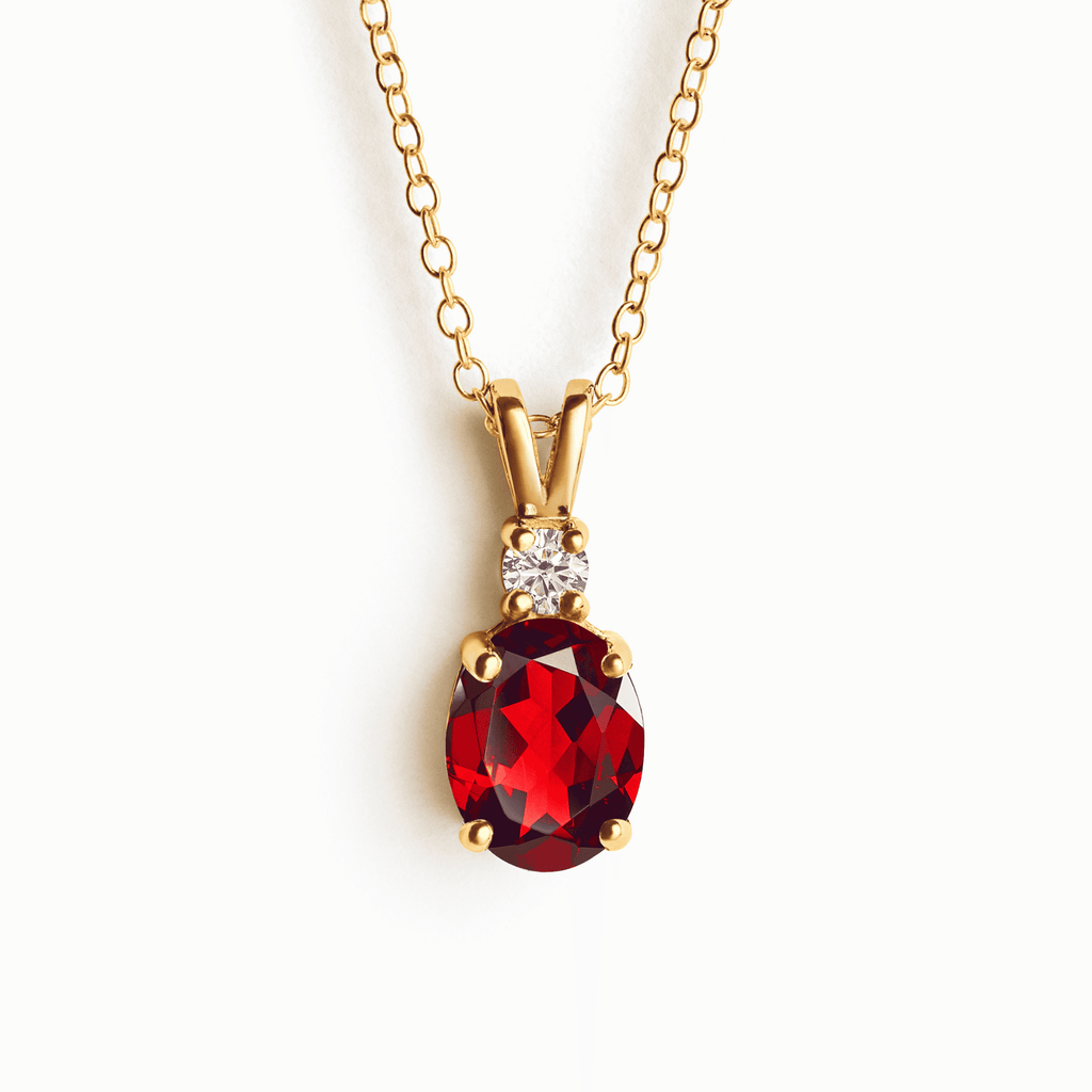 Gold-vermeil garnet pendant necklace with oval red stone and small crystal accents