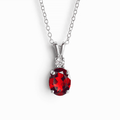 Sterling silver garnet pendant necklace with oval red gemstone and diamond halo accents