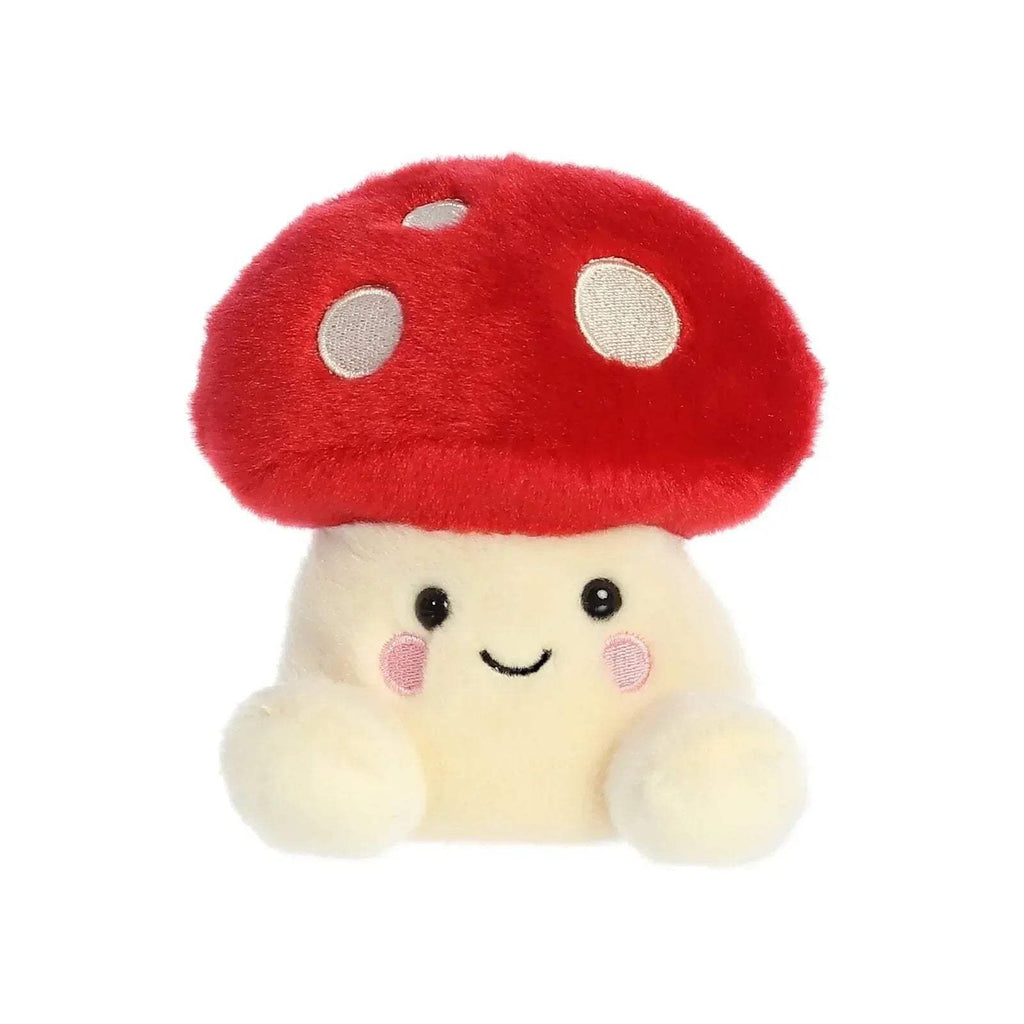 Red and cream mushroom soft toy with smiling face and white spots on cap