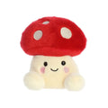 Red and cream mushroom soft toy with smiling face and white spots on cap