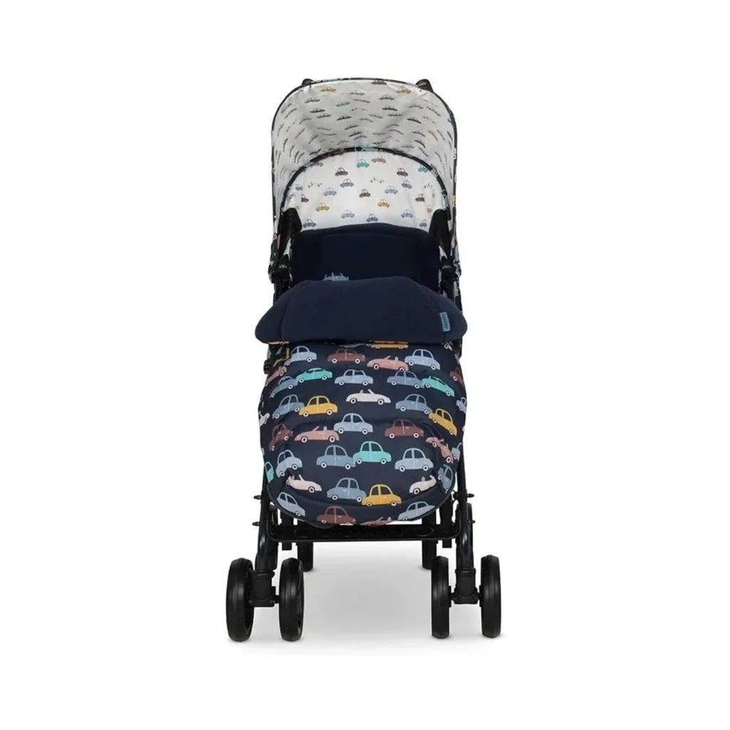 Stroller front view with car-pattern seat cover and padded footmuff, dark canopy