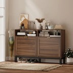 Rustic brown shoe cabinet with two closed drawers and shoes stored on the lower shelf