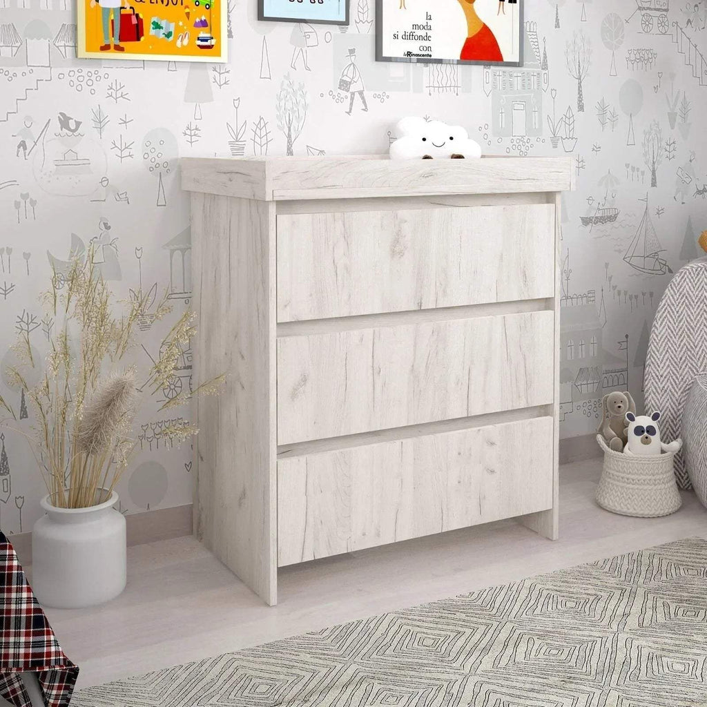 White baby changing unit with two open shelves and horizontal rail, light wood grain