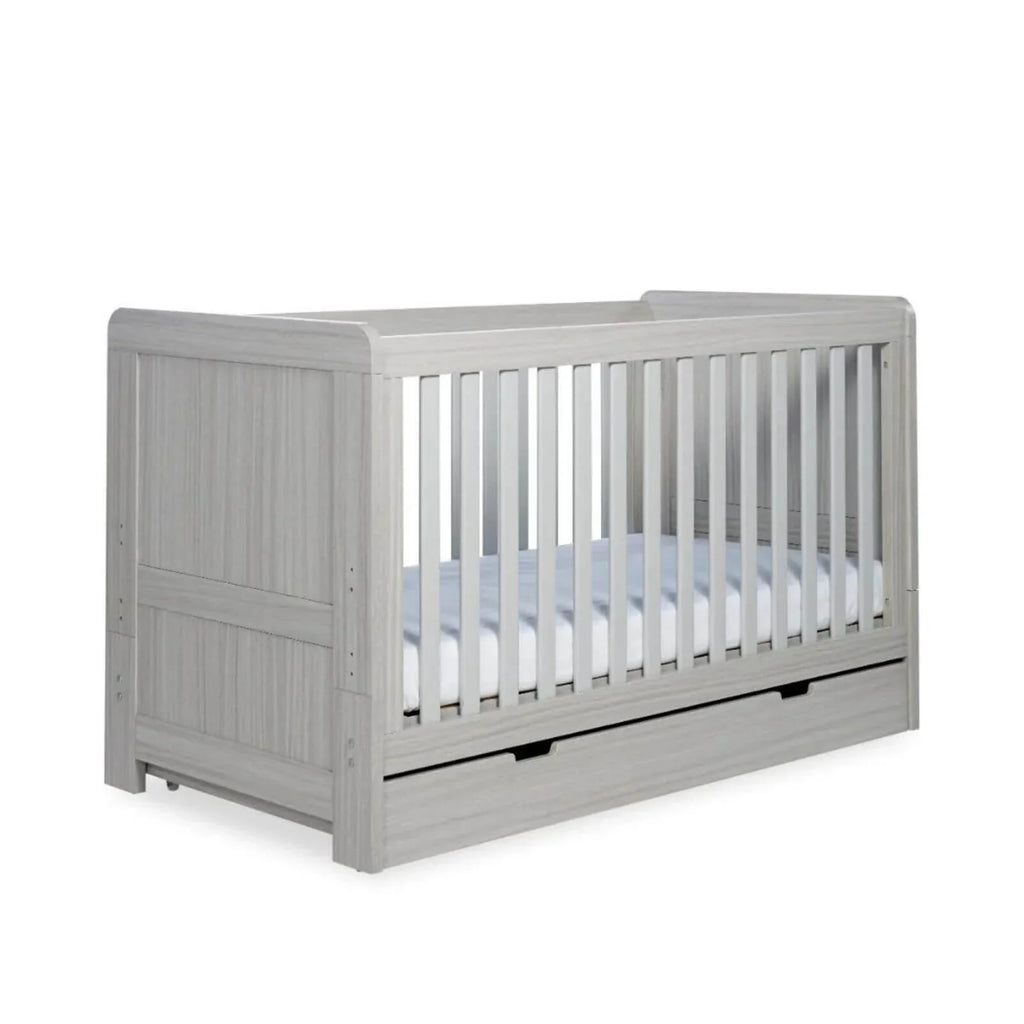 Ash grey cot bed with vertical slat sides and front drawer base
