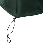 Green drawstring tie point on patio furniture cover edge for tighter securing.