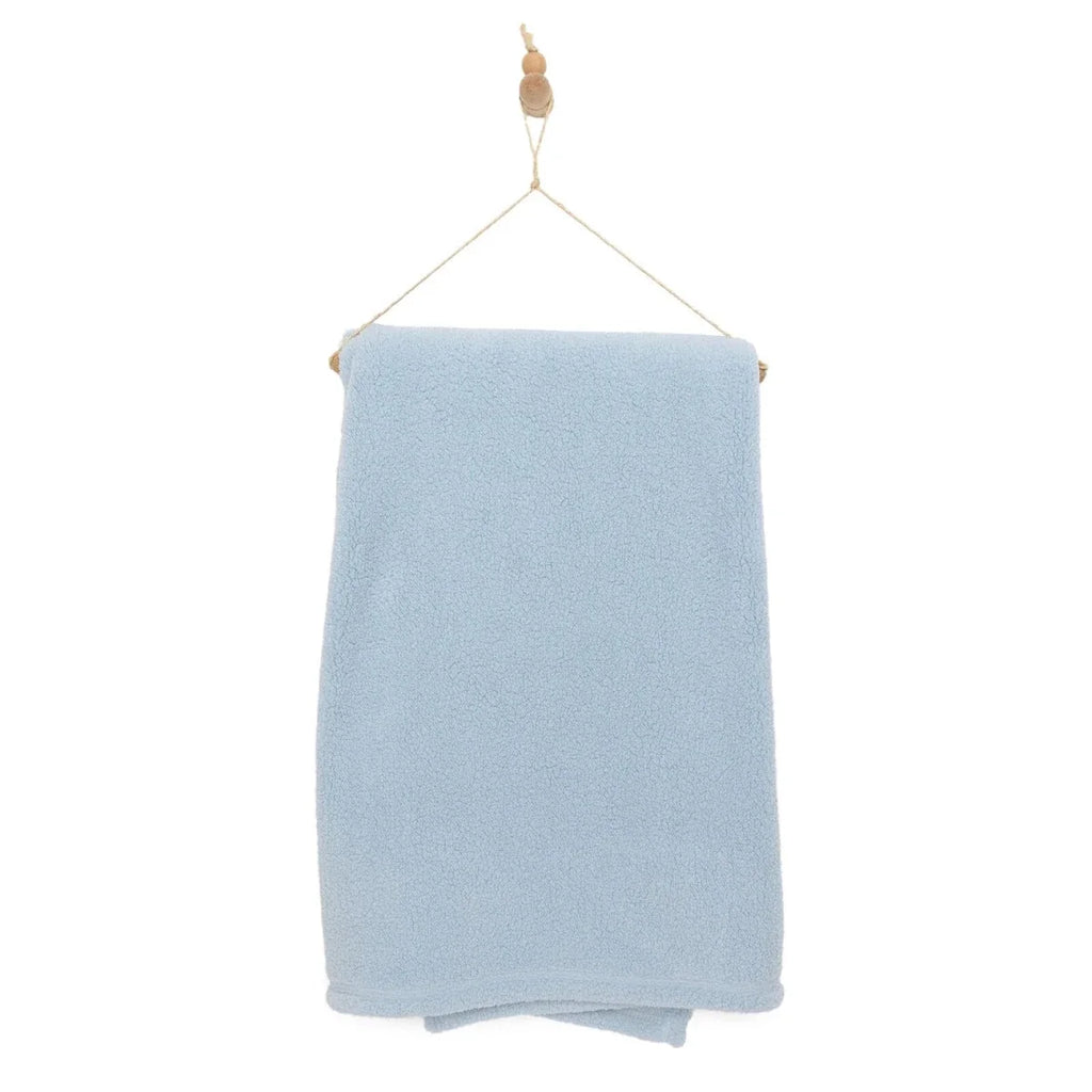 Blue sherpa fleece baby blanket on hanging cord