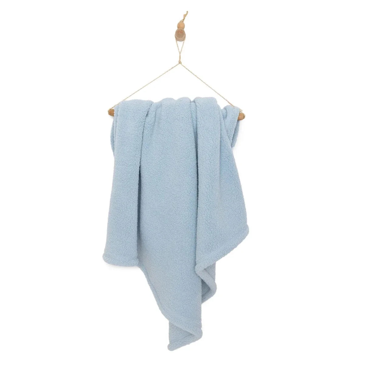 Blue sherpa fleece baby blanket draped with gathered folds