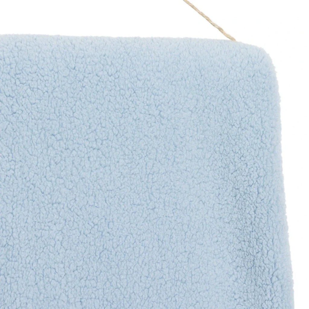 Blue sherpa fleece baby blanket, smooth side panel close-up
