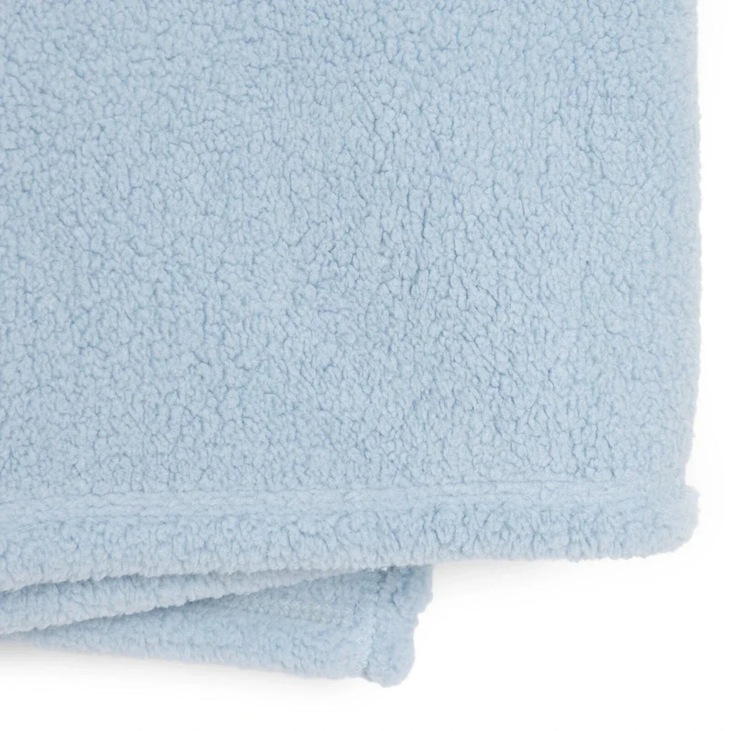 Blue sherpa fleece baby blanket, folded edge detail