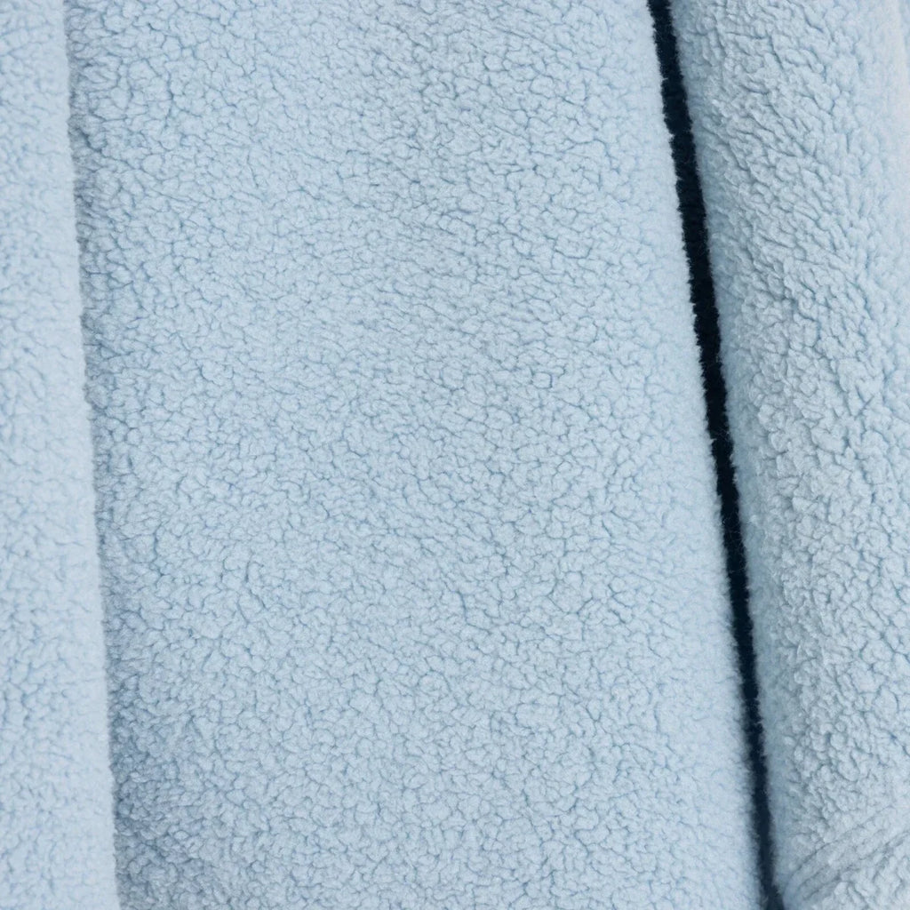 Blue sherpa fleece baby blanket with dark edge seam line