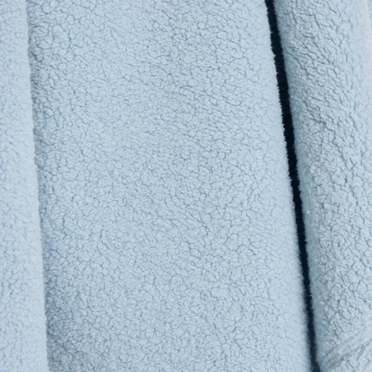 Blue sherpa fleece baby blanket with dark edge seam line