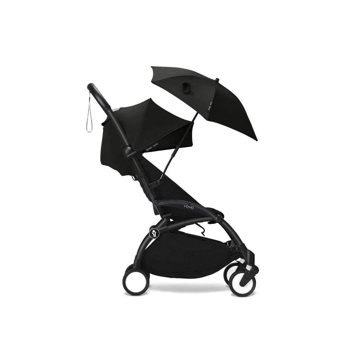 Black stroller parasol on pushchair, open umbrella canopy with folded shade cover