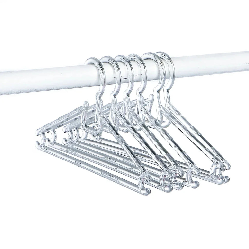 Crystal clear baby clothes hanger set on a rack with multiple curved hooks