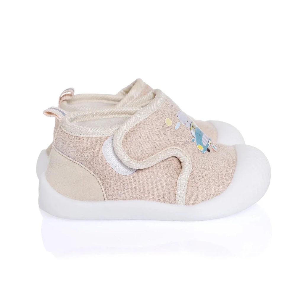 Baby first walker shoe in beige fabric with cartoon travel print and white grippy sole