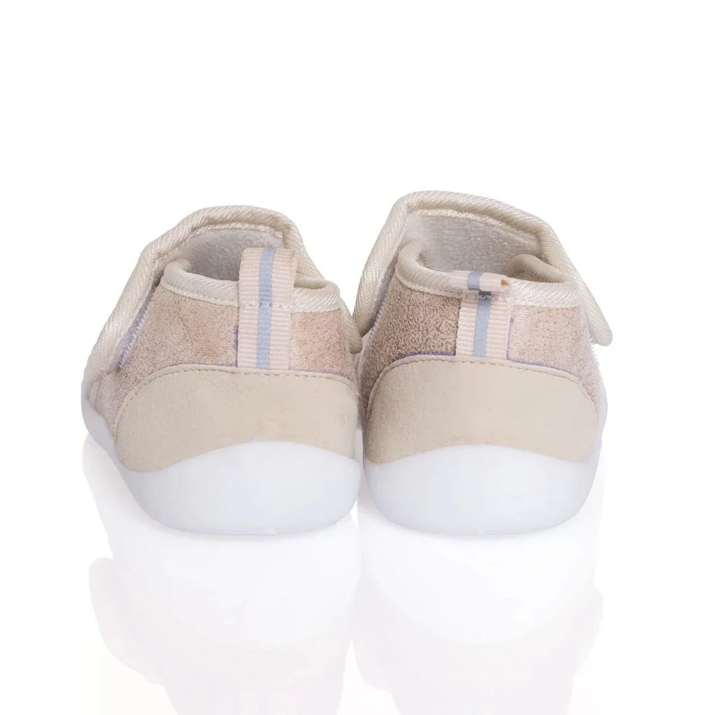 Baby first walker shoes back view, beige upper with padded heel and white sole