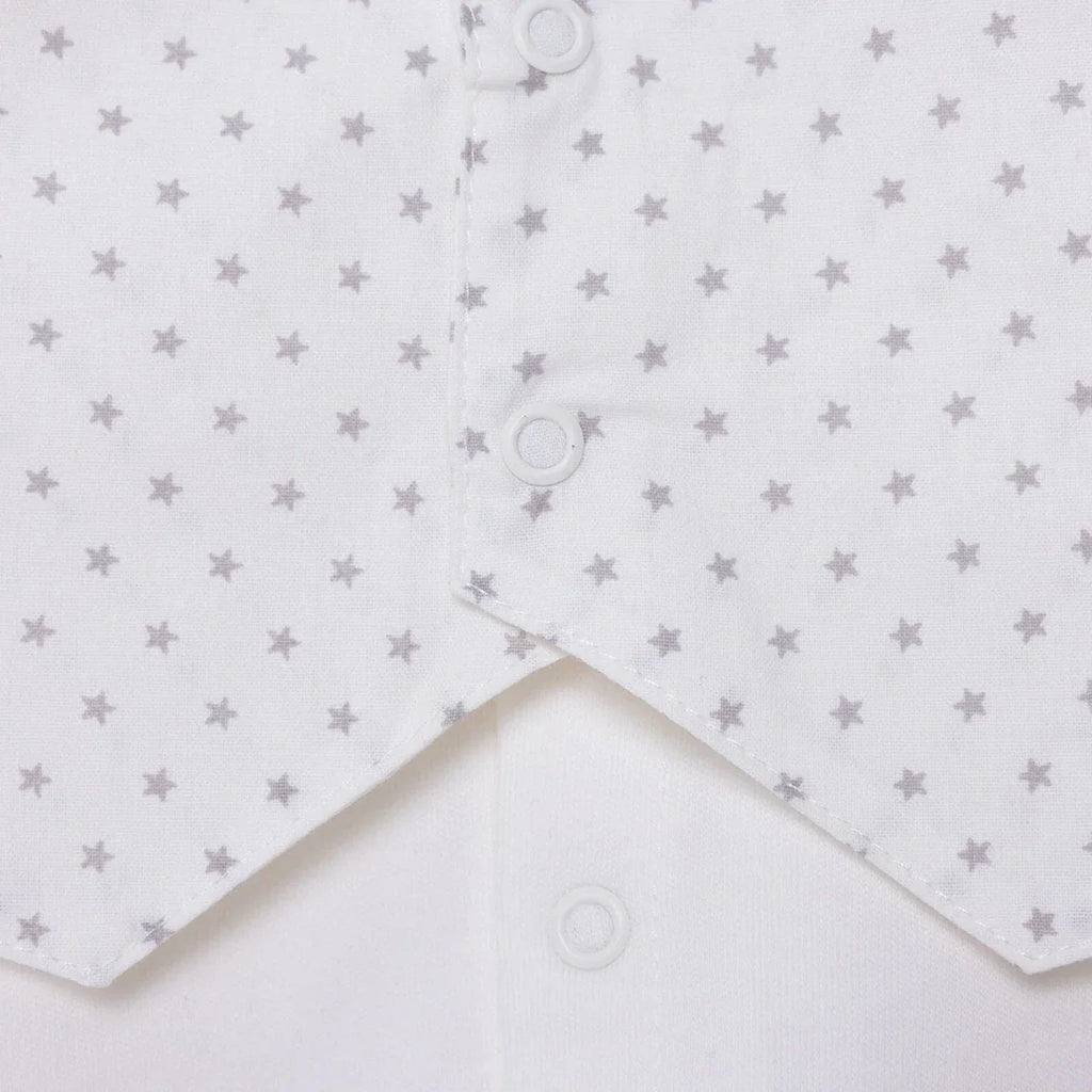 White baby shirt front with star print yoke and round snap closures