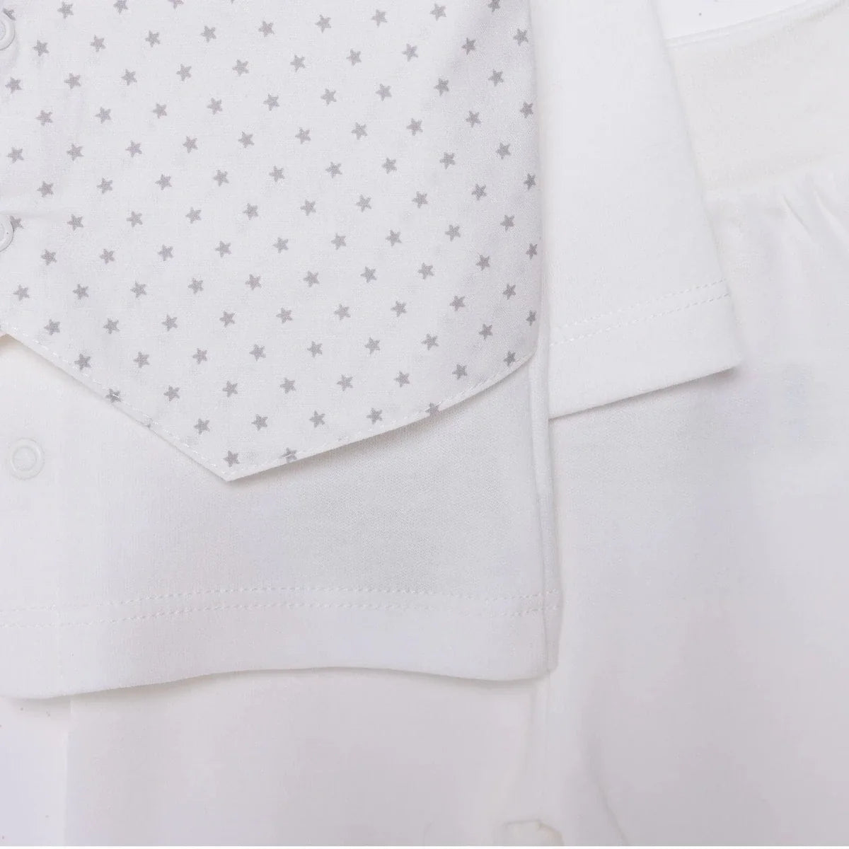 White baby shirt with small star print yoke and matching snap pants