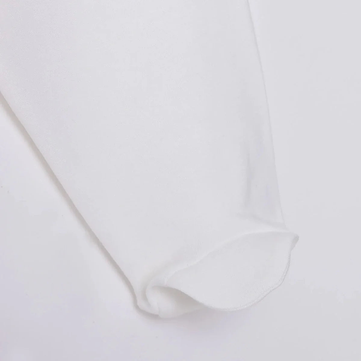 White baby pant leg with soft folded cuff at the ankle
