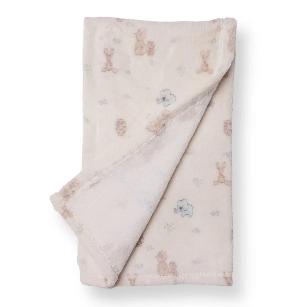Folded baby fleece blanket in light cream with pastel animal motifs and stitched edge