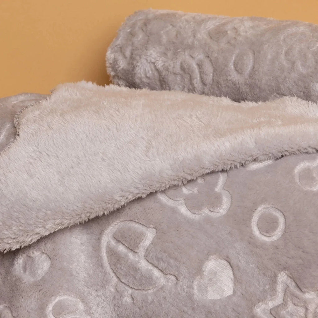 Grey baby blanket close-up of plush fleece and sky icons pattern
