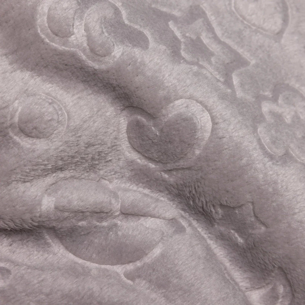 Grey baby blanket close-up of soft fleece with raised sky-themed hearts and clouds