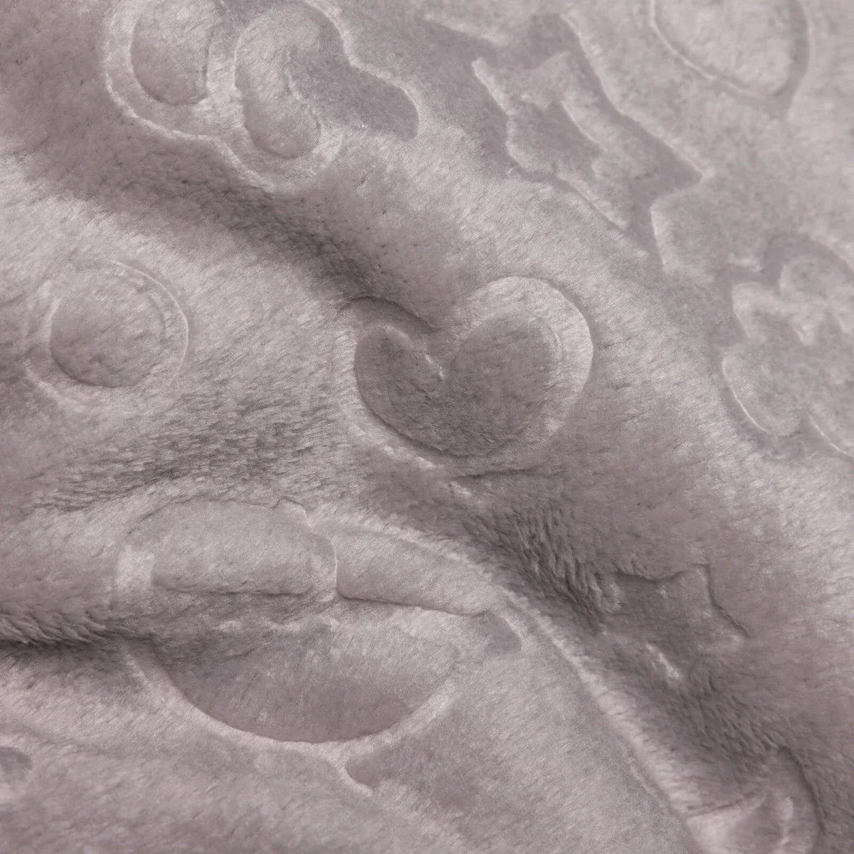 Grey baby blanket close-up of soft fleece with raised sky-themed hearts and clouds