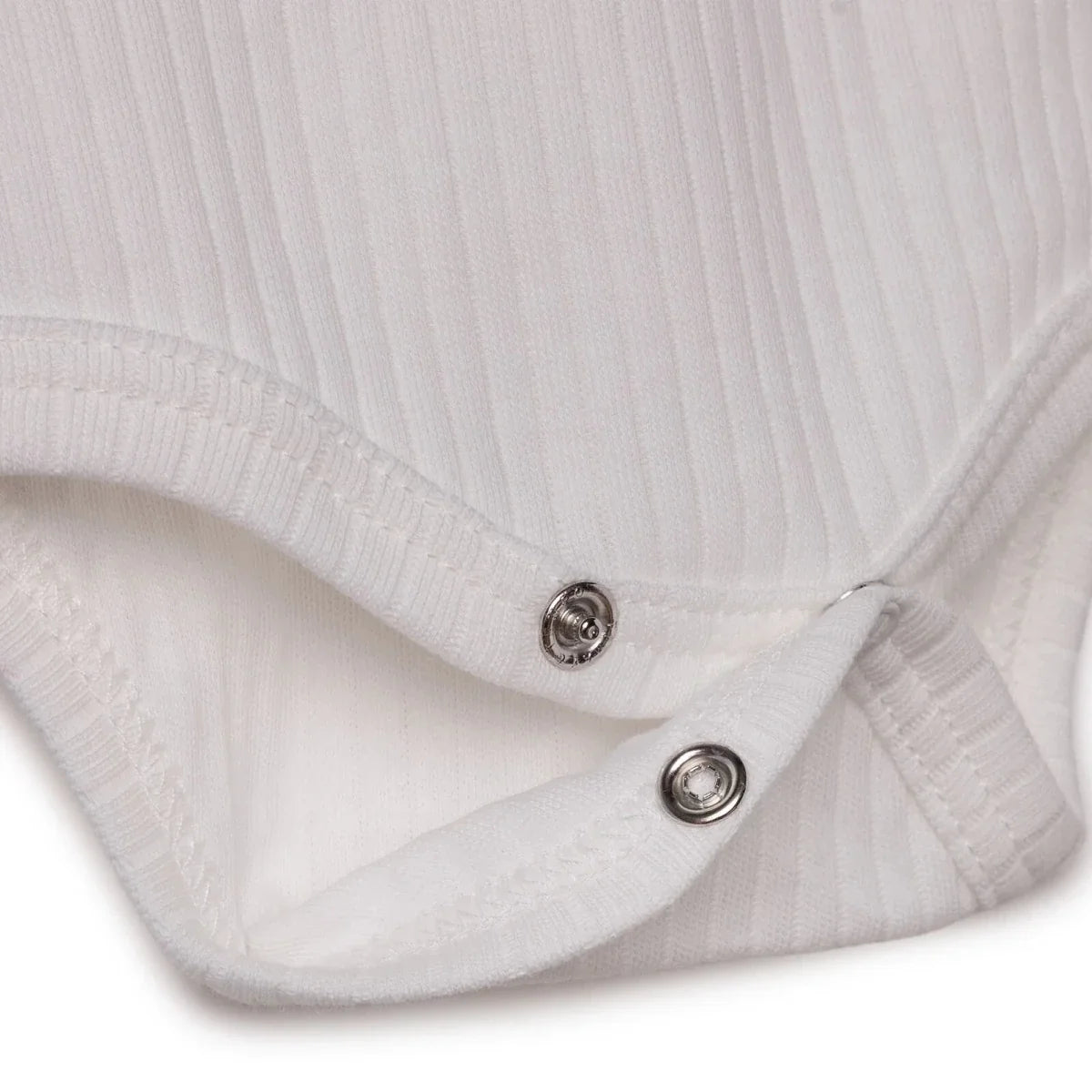 White bodysuit with snap buttons at the envelope seam