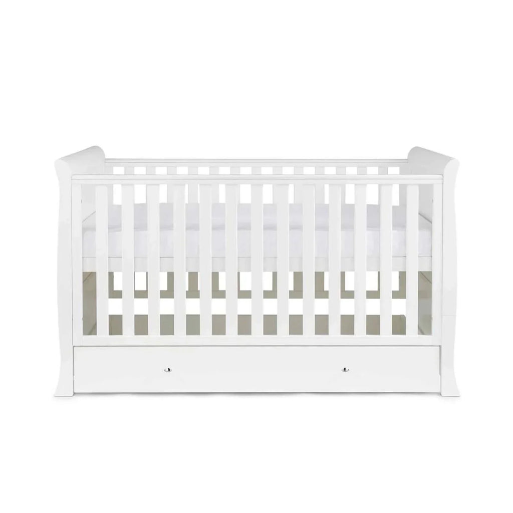 White cot bed with vertical rail bars and front drawer storage