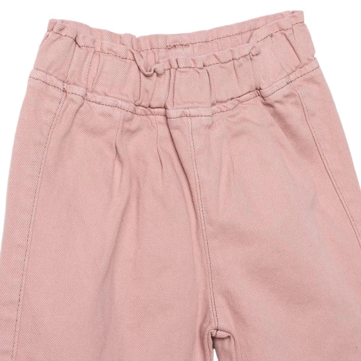 Pink baby trousers close-up of elastic waist and stitched front panel