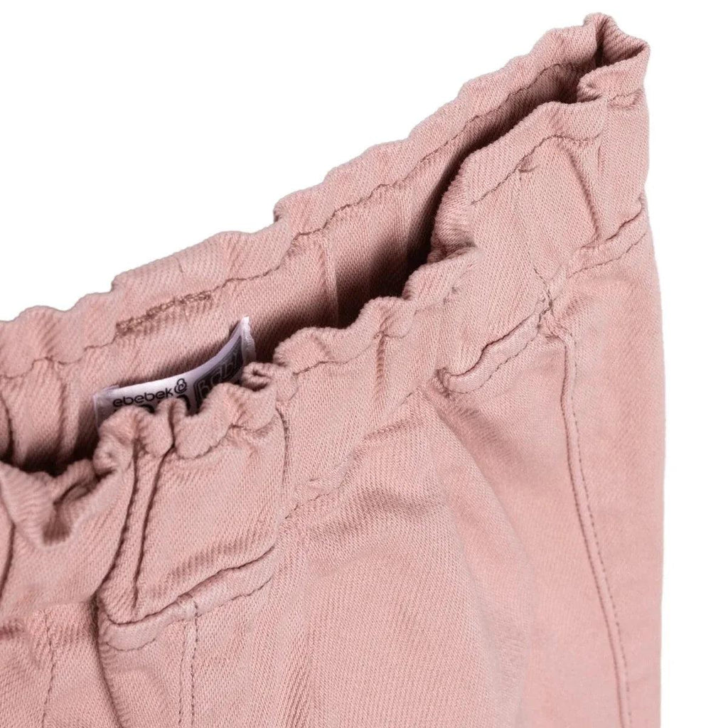 Pink baby trousers waistband with inner label and seam detailing