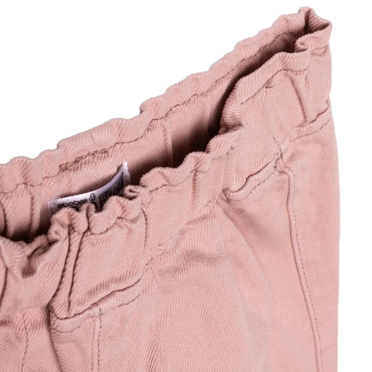 Pink baby trousers waistband with inner label and seam detailing