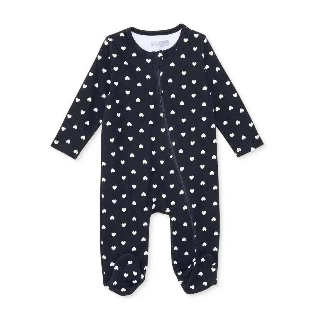Black long-sleeve baby sleepsuit with feet, allover white heart print, front zipper