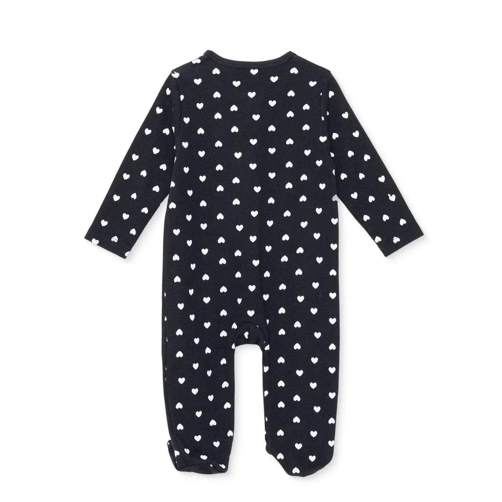 Black long-sleeve baby sleepsuit with feet, back view, white heart print